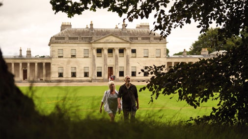 Visitors walking in the grounds of Castle Coole, County Fermanagh, Northern Ireland